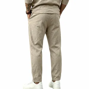 Close-up back view of men's loose khaki linen cotton straight leg trousers for vacation.