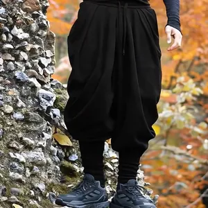 Détail du pantalon harem noir ample pour homme avec taille élastique à cordon de serrage