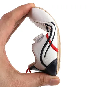 Detailed view demonstrating the high flexibility and soft sole of white baby walking shoe