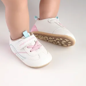 Detail of baby pre-walker shoes with soft non-slip sole and magic prewalker strap.