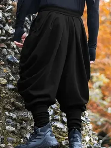 Pantalon sarouel noir pour hommes style high street avec design drapé décontracté