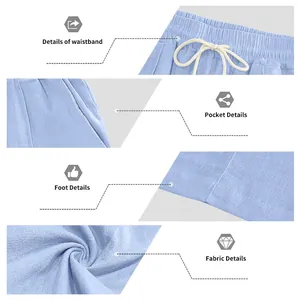 Detailed view of blue cotton linen pants showing waistband, pocket, and fabric texture.