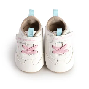 Detailed view of cream baby prewalker shoes with pink laces and soft sole