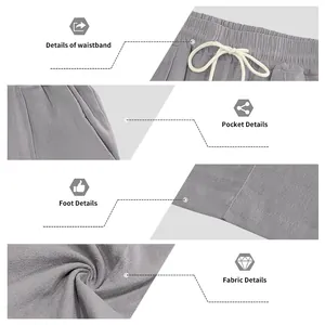 Detail view of grey linen pants showing drawstring waistband and fabric texture