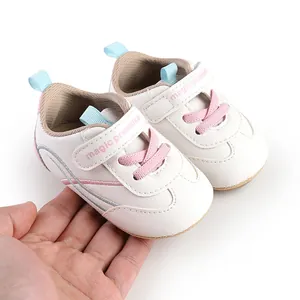 Detailed view of white baby prewalker shoes with pink laces for 0-1 year old infants