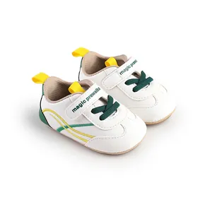 Detailed view of white baby pre-walker shoes with soft sole and Velcro straps.