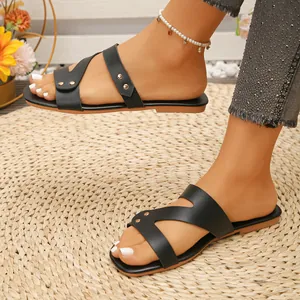 Vintage black flat sandals with rivets for women, perfect for beach and summer wear