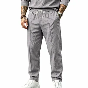 Casual men's cotton linen pants in grey with a loose straight-leg fit for vacation style