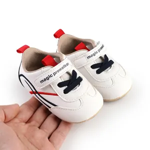 Detailed view of soft-sole newborn baby prewalker shoes featuring magic prewalker print