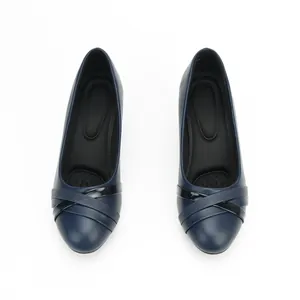 Professional navy blue low-cut pumps with decorative criss-cross straps for women