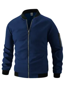 Detail view of men's blue waffle knit zip-up jacket with ribbed stand collar