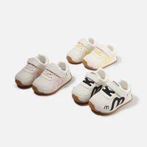 Stylish children's white sneakers with soft non-slip rubber soles in pink, yellow, and black