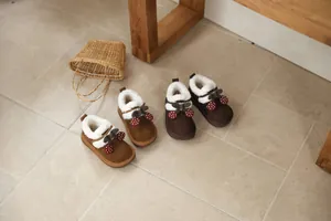 Cozy girls' winter snow boots featuring cute cherry accents and warm faux fur lining