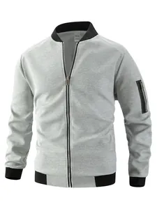 Detailed view of men's gray waffle knit jacket featuring black ribbed trim and sleeve pocket