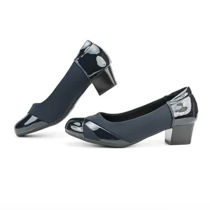 Elegant navy blue women's mid-block heel pumps featuring patent leather and fabric upper