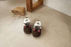 Warm brown girl's snow boots featuring cozy plush lining and cute cherry details