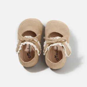 Baby girl khaki suede walking shoes featuring delicate lace trim and cute bow accent