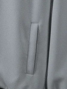 Detailed close-up showing the premium waffle knit texture and side pocket of grey jacket