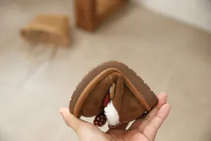 Flexible sole of cute brown cherry snow boots for girls showing soft material quality.