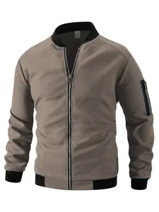 Close-up of men's taupe waffle-knit zip-up jacket with black ribbed collar and cuffs