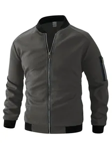 Detailed view of a men's dark grey waffle knit bomber jacket featuring a zipper and stand collar