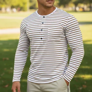Detailed view of men's brown striped long-sleeved Henley shirt in a natural park