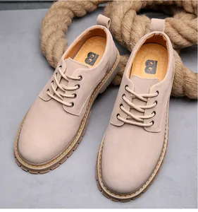 Detail view of beige men's suede casual work shoes with thick rope background