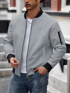 Men's grey waffle knit bomber jacket with stand collar and zipper pocket in street setting