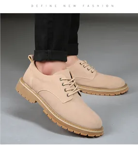 Close-up of men's khaki suede casual shoes with thick gum soles and lacing detail.