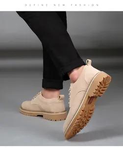Detail view of beige suede men's work shoes featuring a durable gum lug sole design