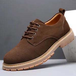 Classic brown suede derby shoes for men with thick rubber soles in a studio setting