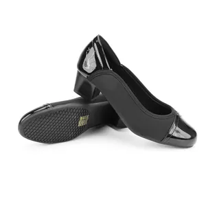 Detail view of black square toe block heels showing matte and patent leather