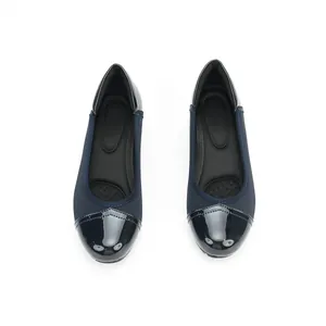 Top view of navy blue flats with patent leather toe cap and matte finish