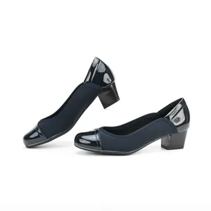 Detailed side view of elegant navy blue women's square toe pumps with a stable block heel