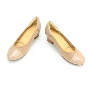 Detail view of vintage beige square-toe pumps featuring comfortable block heels for women