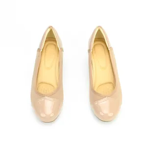 Top view detail of beige patent leather toe cap women's flat ballet shoes