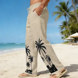 Detailed view of stylish men's beige beach pants with black palm tree print design