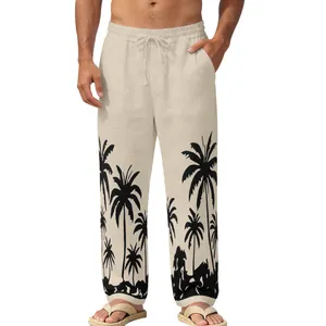 Close-up of men's beige beach trousers with tropical black palm tree silhouettes