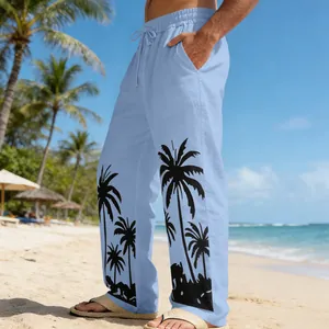 Detail view of men's stylish light blue beach trousers featuring a black palm tree print