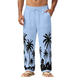 Detailed view of men's casual light blue beach trousers with black palm tree prints