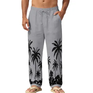 Detailed macro view of grey men's summer beach pants featuring black palm tree prints