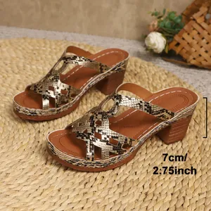 Detailed view of snake print wedge sandals highlighting the 2.75 inch heel height