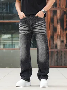 Close-up of men's loose straight-leg denim jeans featuring intricate rhinestone wash detail