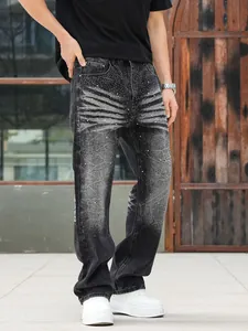 Macro view of men's loose straight jeans with rhinestone pattern and heavy washed black denim
