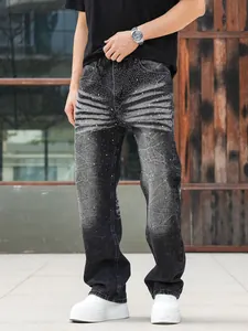 Detailed full-length shot of men's loose straight jeans with heavy rhinestone wash finish