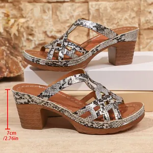 Detailed view of snake print platform Roman sandals with a 7cm chunky high heel