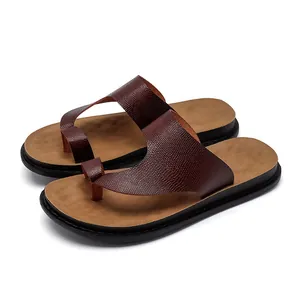 Men's brown textured PU leather flip-flops with comfortable tan footbed and black sole