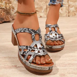 Stylish women's platform Roman sandals with snakeskin pattern and cut-out design details