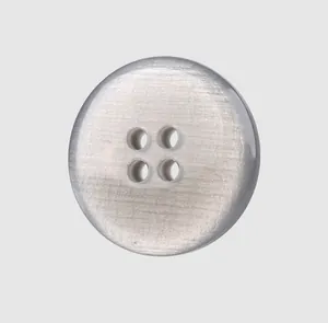 Close-up of premium silver resin button with metallic brushed texture and four holes