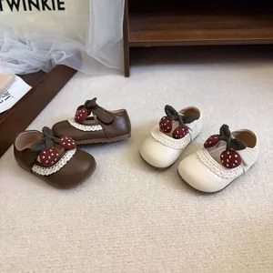 Soft sole baby girl princess shoes with lace trim and cherry bow in brown and cream